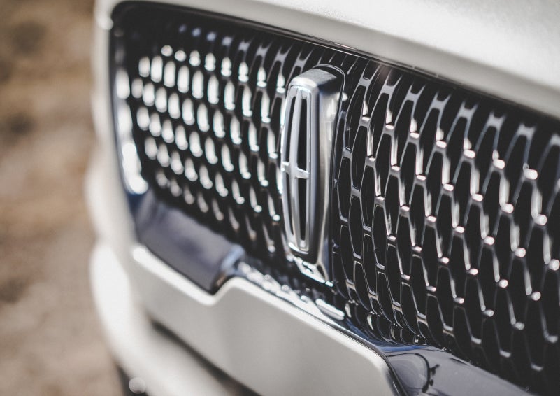 The grille of the 2024 Lincoln Aviator® Reserve model with an eye-catching repeated field of Lincoln Star logo shapes | Crossroads Lincoln of Southern Pines in Southern Pines NC