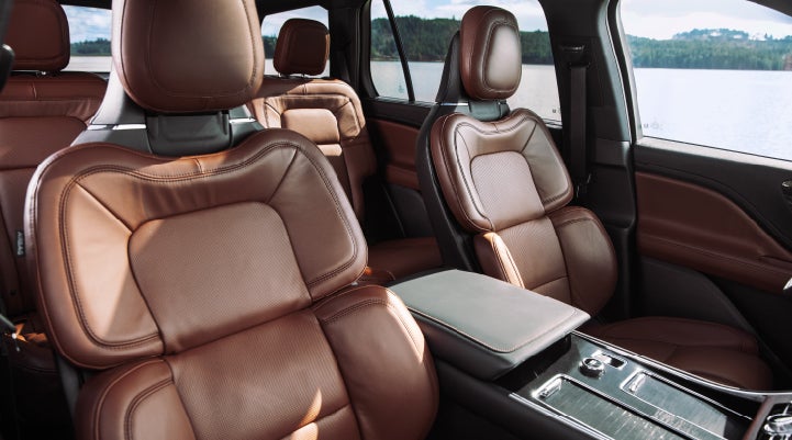 The front row's Perfect Position Seats in a 2024 Lincoln Aviator® Reserve model with Ebony Roast interior | Crossroads Lincoln of Southern Pines in Southern Pines NC